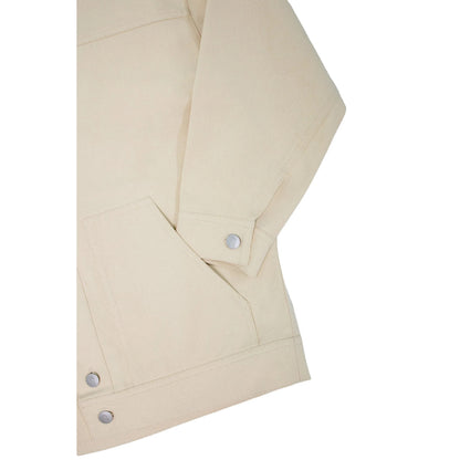 Detailed shot of the functional side pocket and clean stitching on the khaki denim.