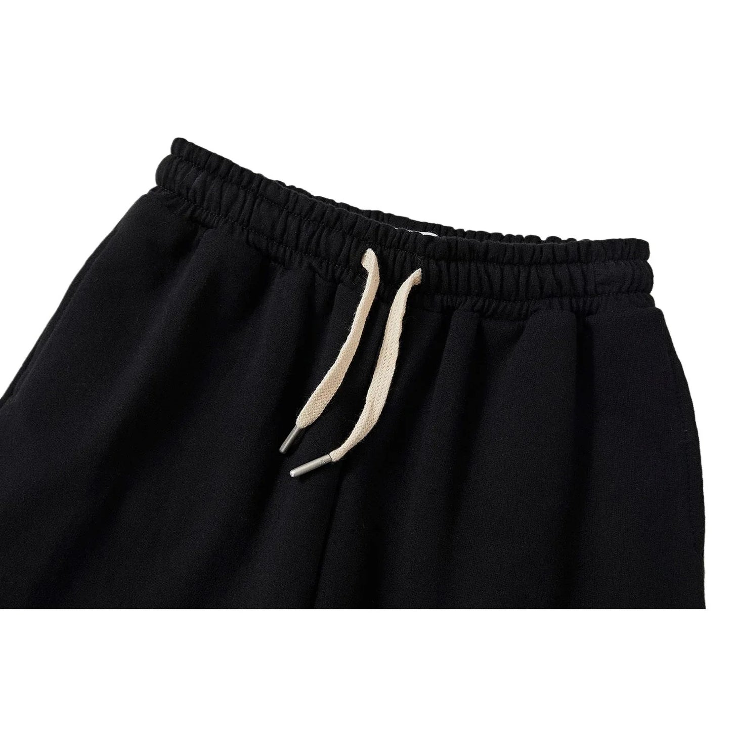 Close-up of the elastic waistband and cream-white drawstring on Ogender joggers.