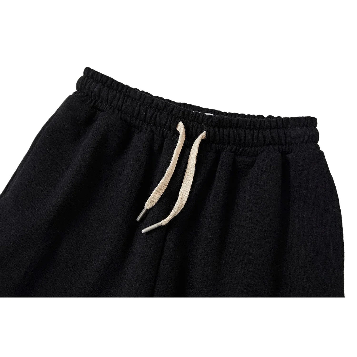 Close-up of the elastic waistband and cream-white drawstring on Ogender joggers.