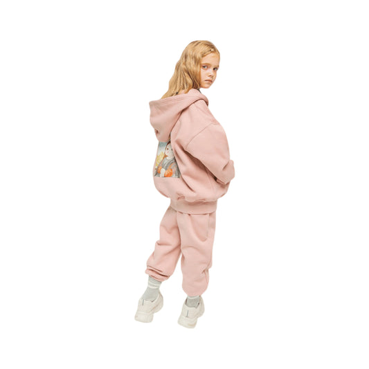 Side profile of the model wearing the fleece joggers, showcasing the relaxed fit.
