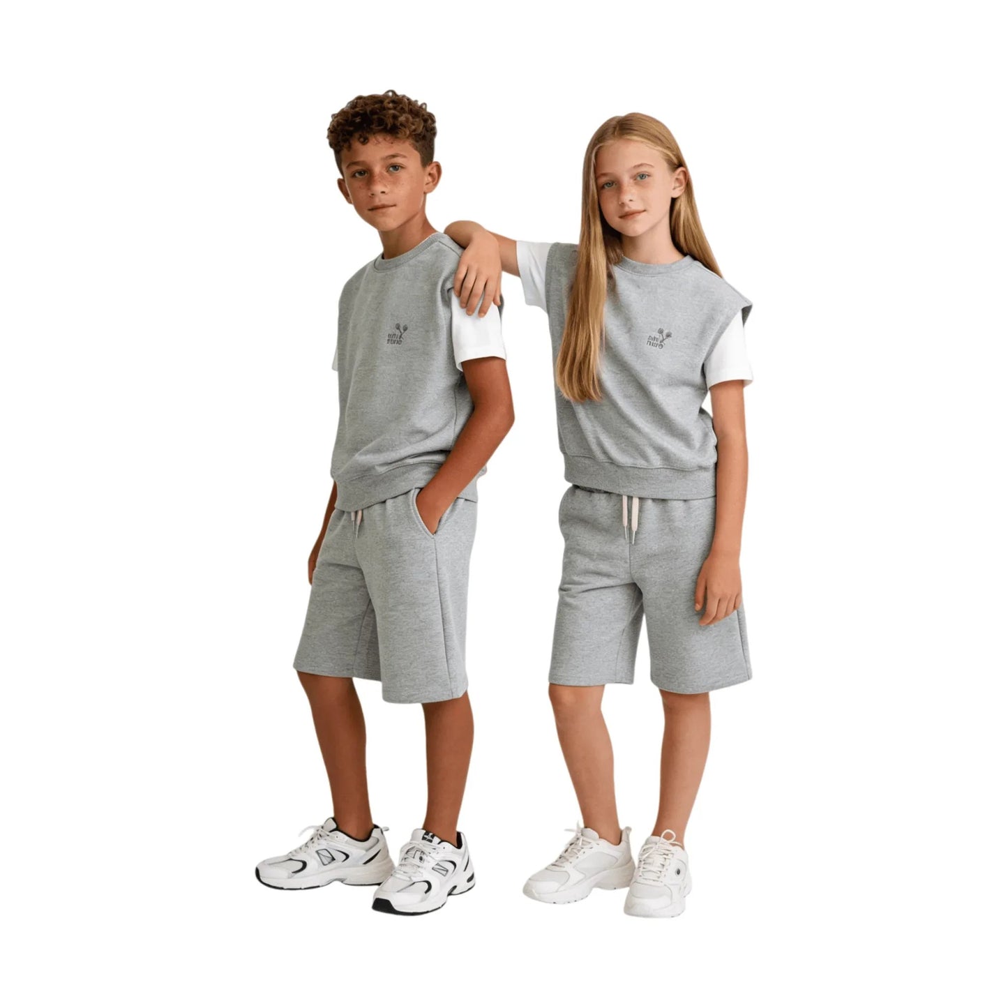Junior models wearing Ogender oversized light grey sweat vests and matching shorts.