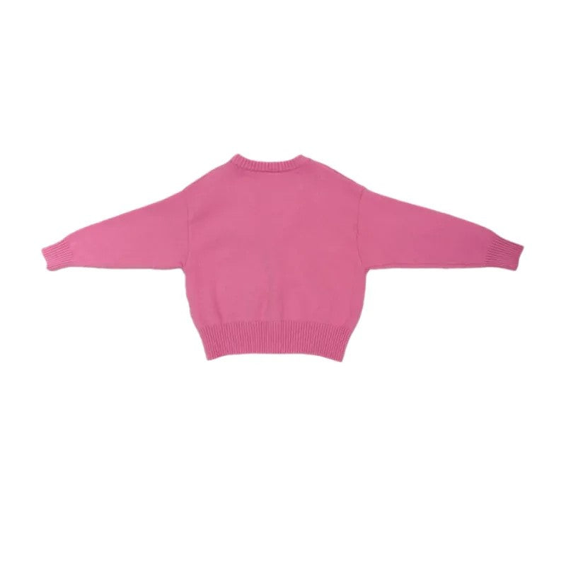 Back view of the minimalist pink knit cardigan, showing the clean, relaxed silhouette