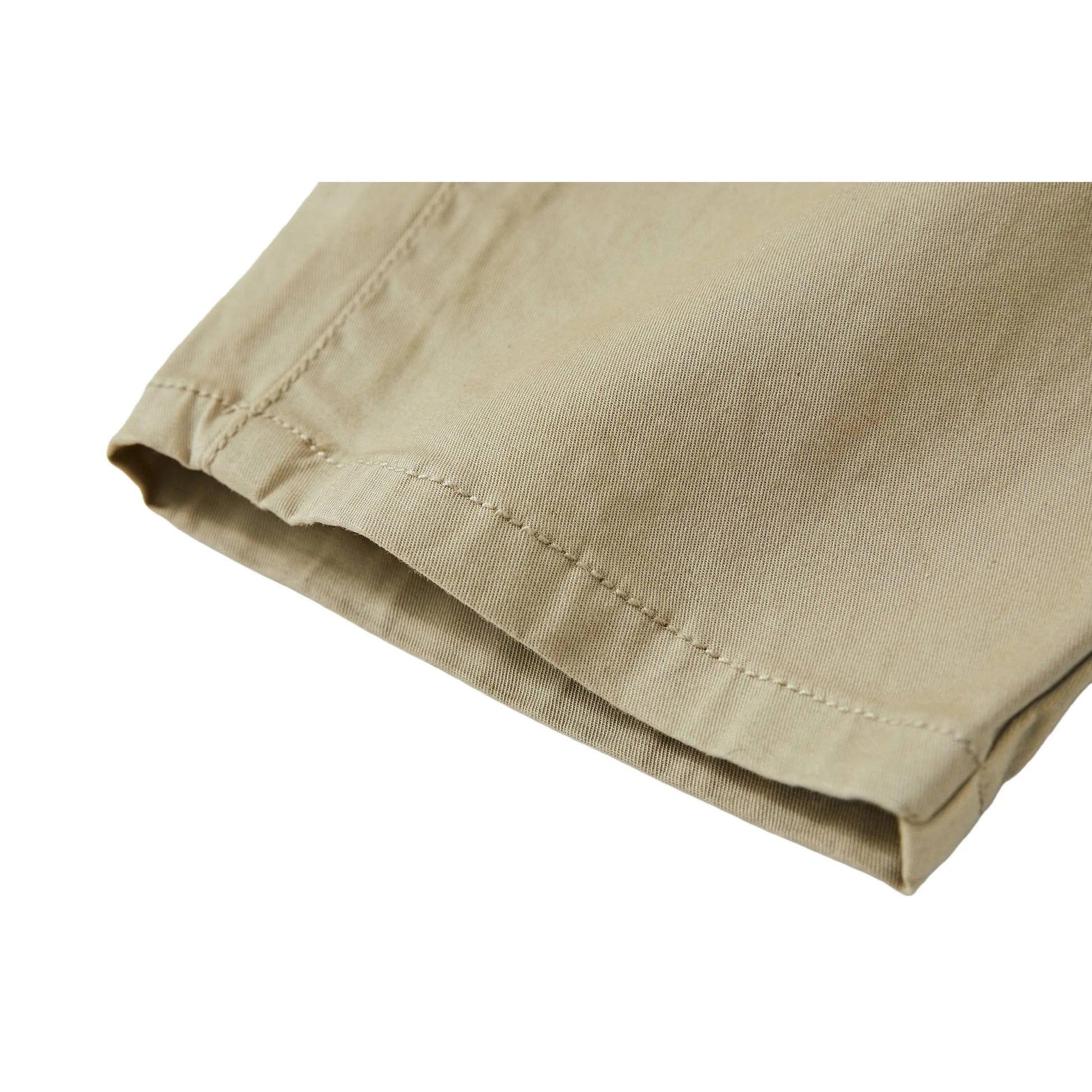 Detailed shot of the neat tapered leg hem and premium cotton fabric on Ogender kids pants.