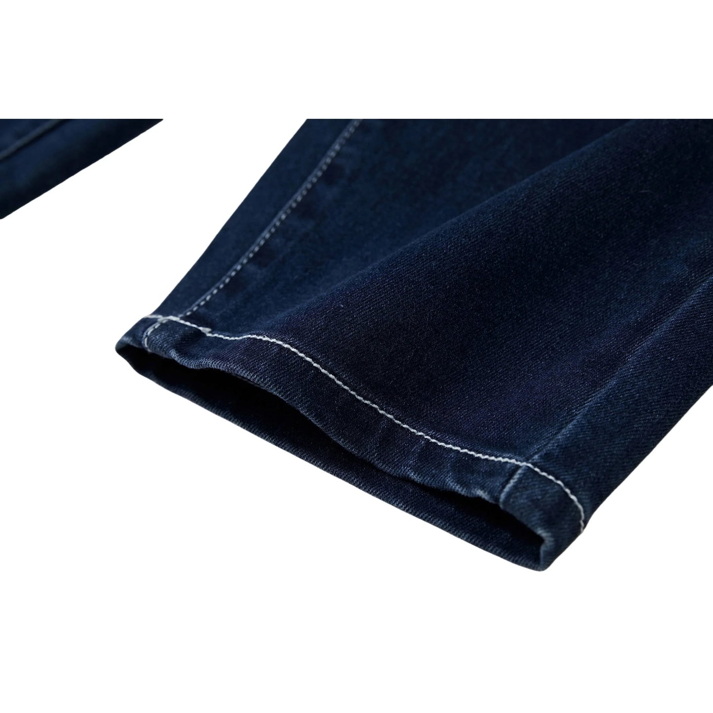 Close-up of the clean tapered hem on Ogender vintage dark blue kids jeans with white contrast stitching.