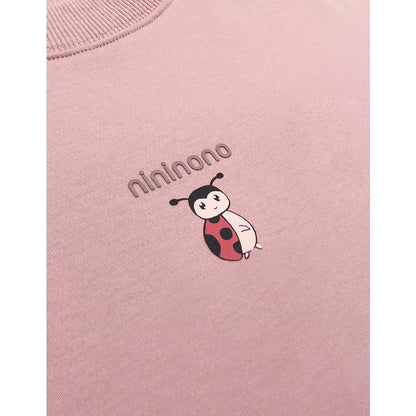 Close-up of the ribbed neckline and the "nininono" ladybird print.