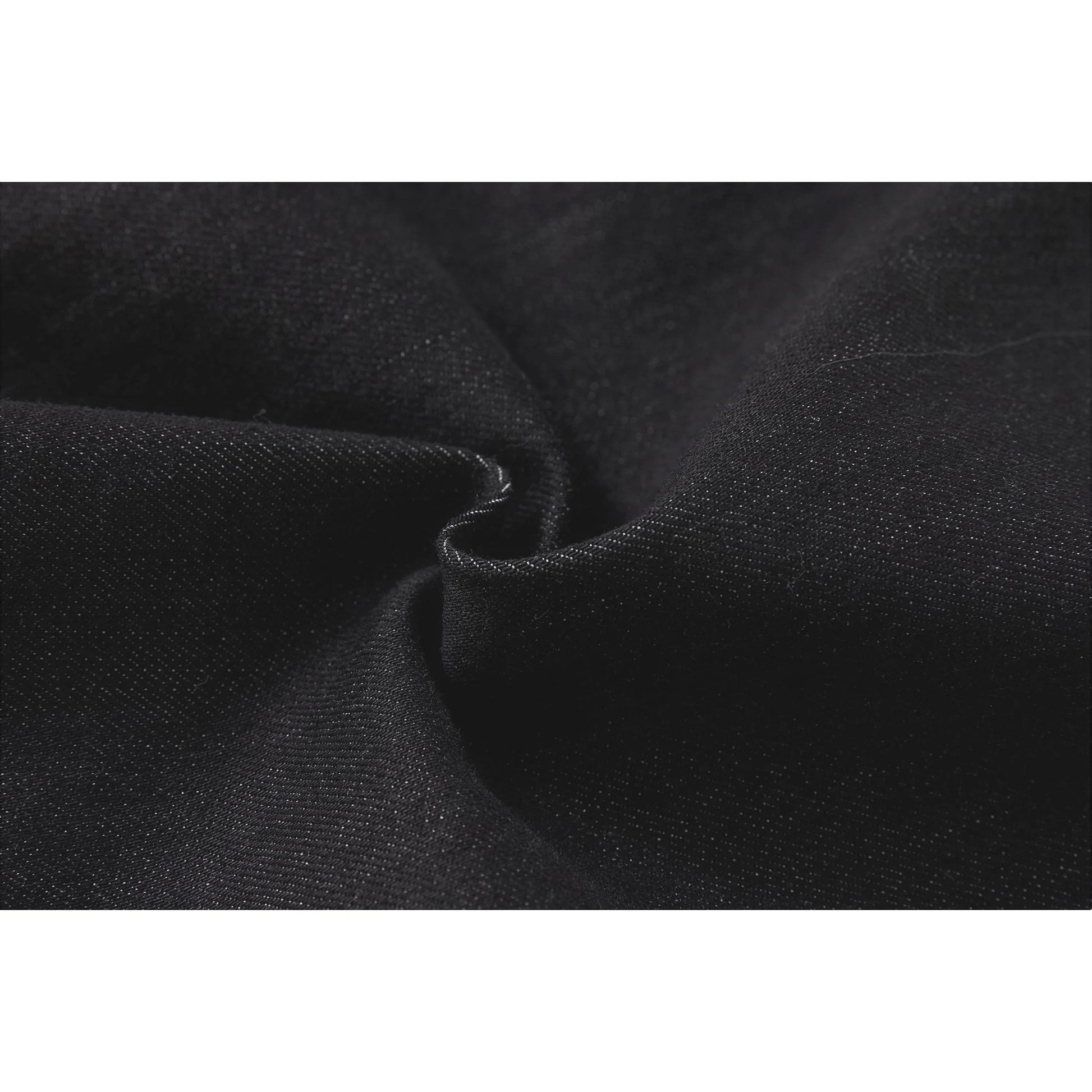 Macro shot of the premium 48% cotton and 20% modal-blend denim fabric texture.