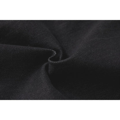 Macro shot of the premium 48% cotton and 20% modal-blend denim fabric texture.