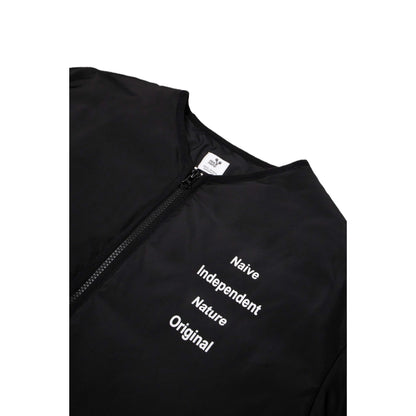 Close-up of the industrial-style white typography on the chest of the black jacket.