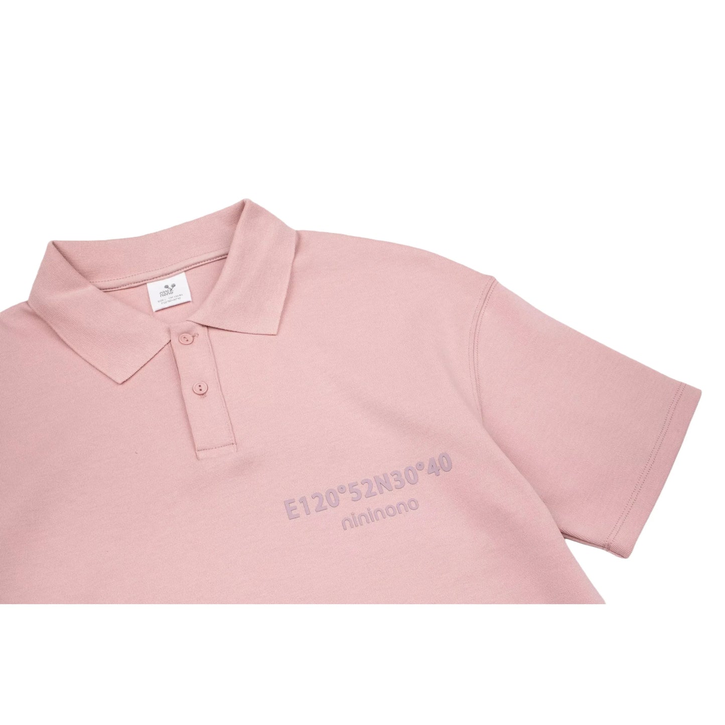 Close-up of the polo collar and the raised 3D silicone "nininono" print on the chest.