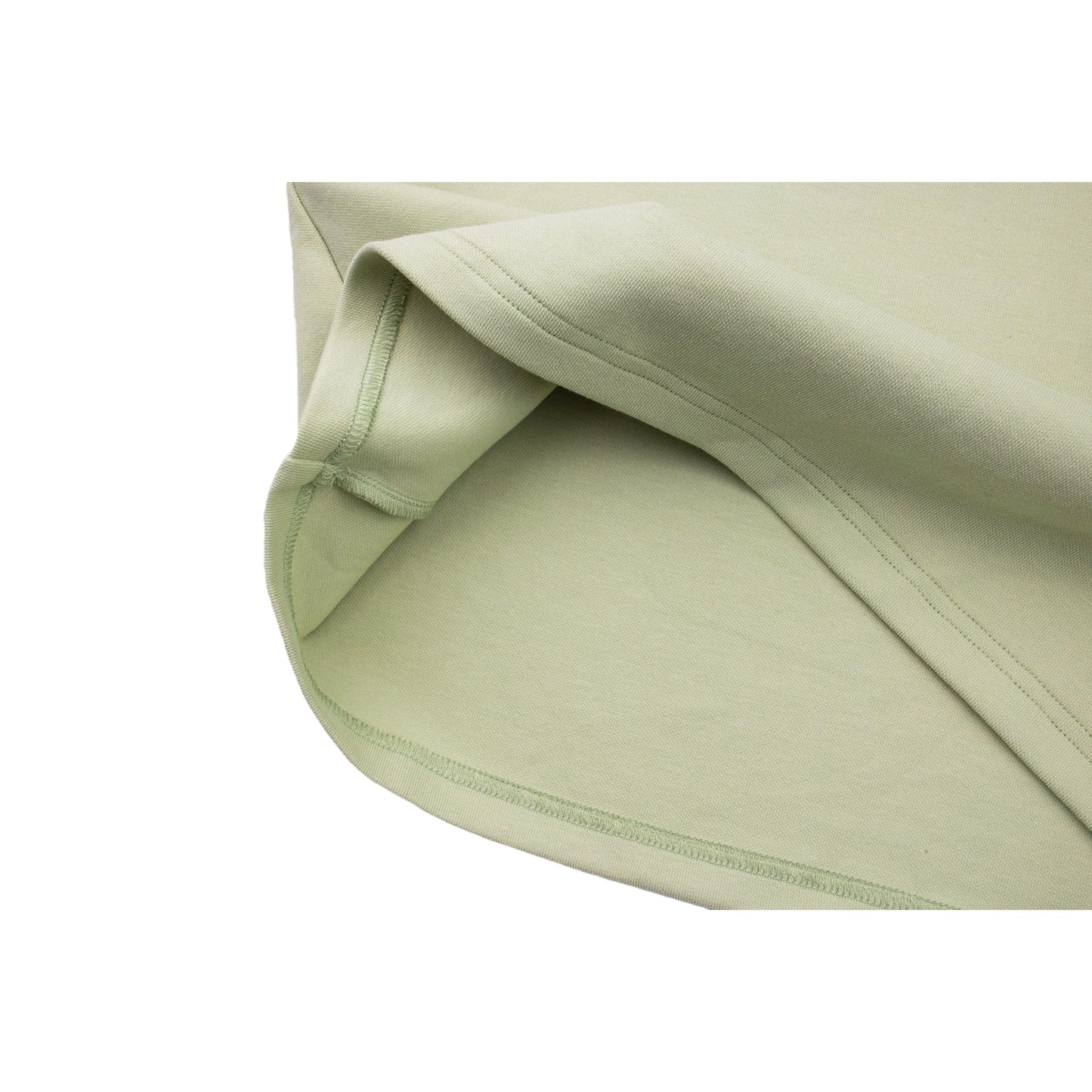 Close-up of the hem flipped over, showing interior stitching and 320 GSM fabric thickness.