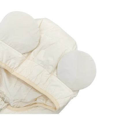 Detailed shot of the playful rounded ears on the hood of the quilted vest.