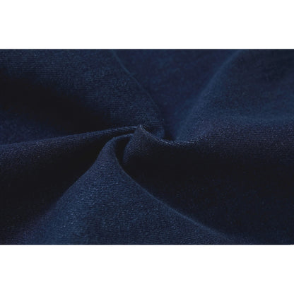 Macro view of the soft-touch denim fabric texture in vintage dark blue.
