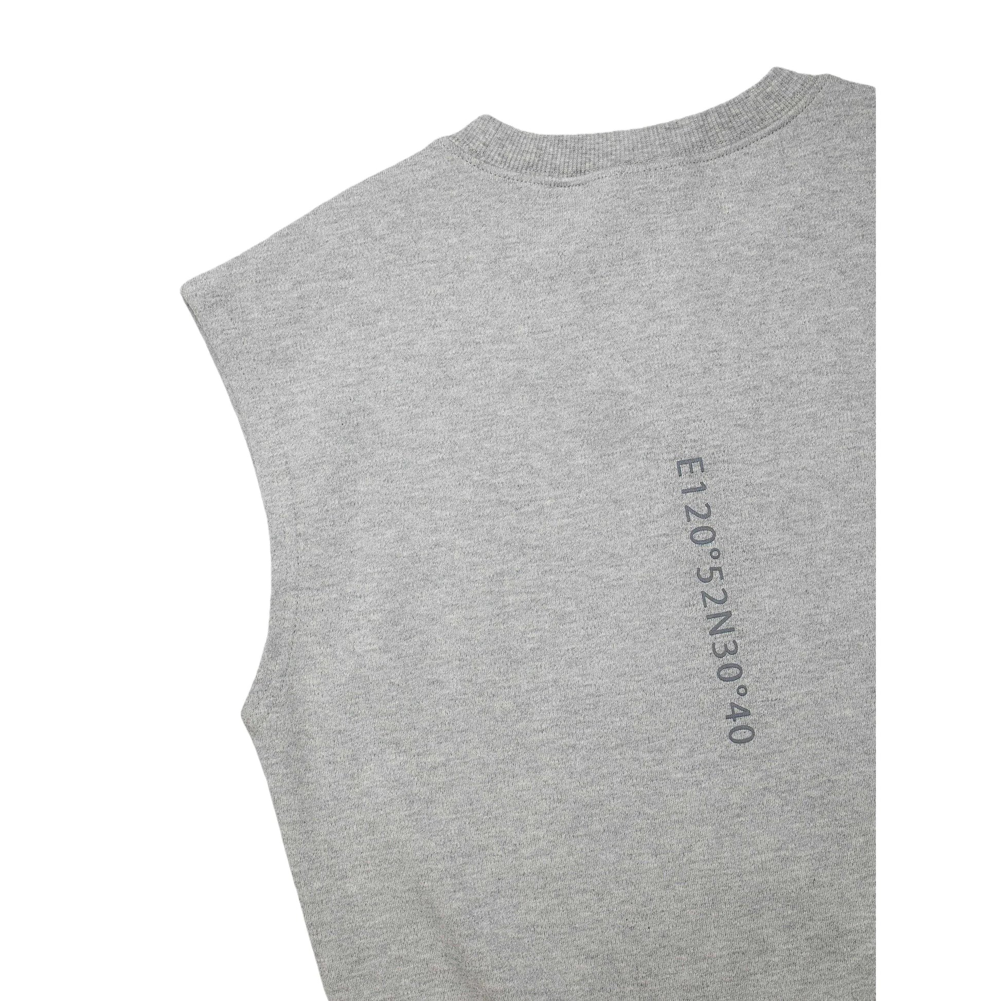 Close-up of the signature vertical typography print on the back of the vest