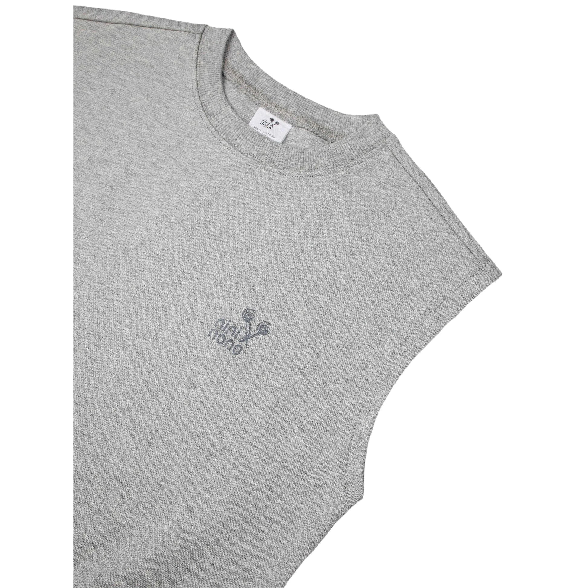 Detail shot of the ribbed crewneck and "nininono" graphic print on the sweat vest.