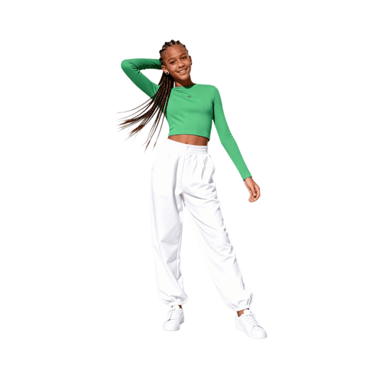 Teenager wearing green slim fit cropped top with white cargo pants, vibrant urban aesthetic.