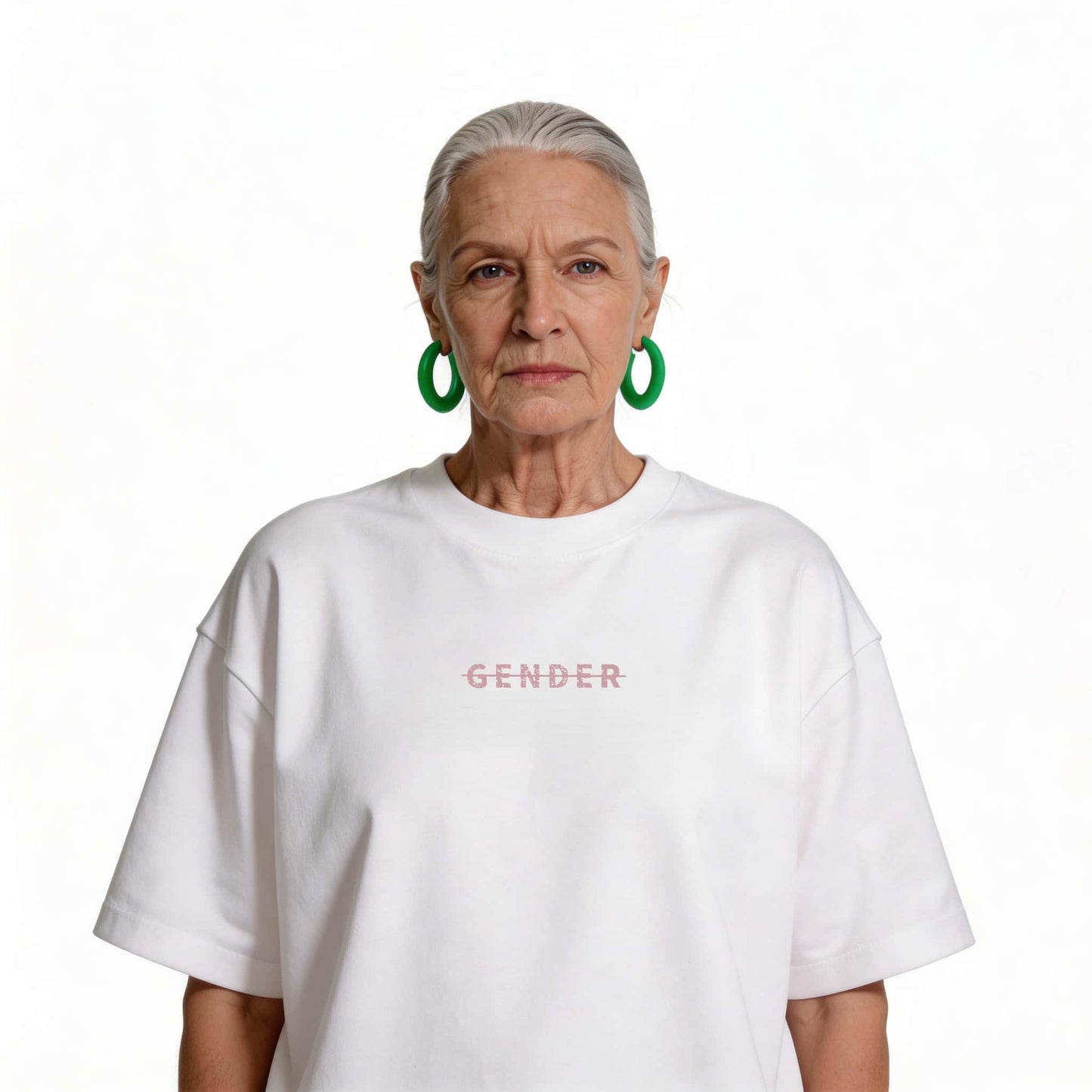 Fashionable senior female model wearing Ogender white oversized cotton tee, demonstrating ageless and gender-neutral streetwear style.