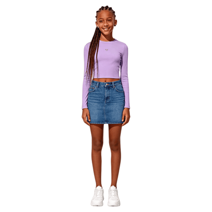 Teenager model wearing dusty purple cropped tee with denim skirt, chic and modern aesthetic look.